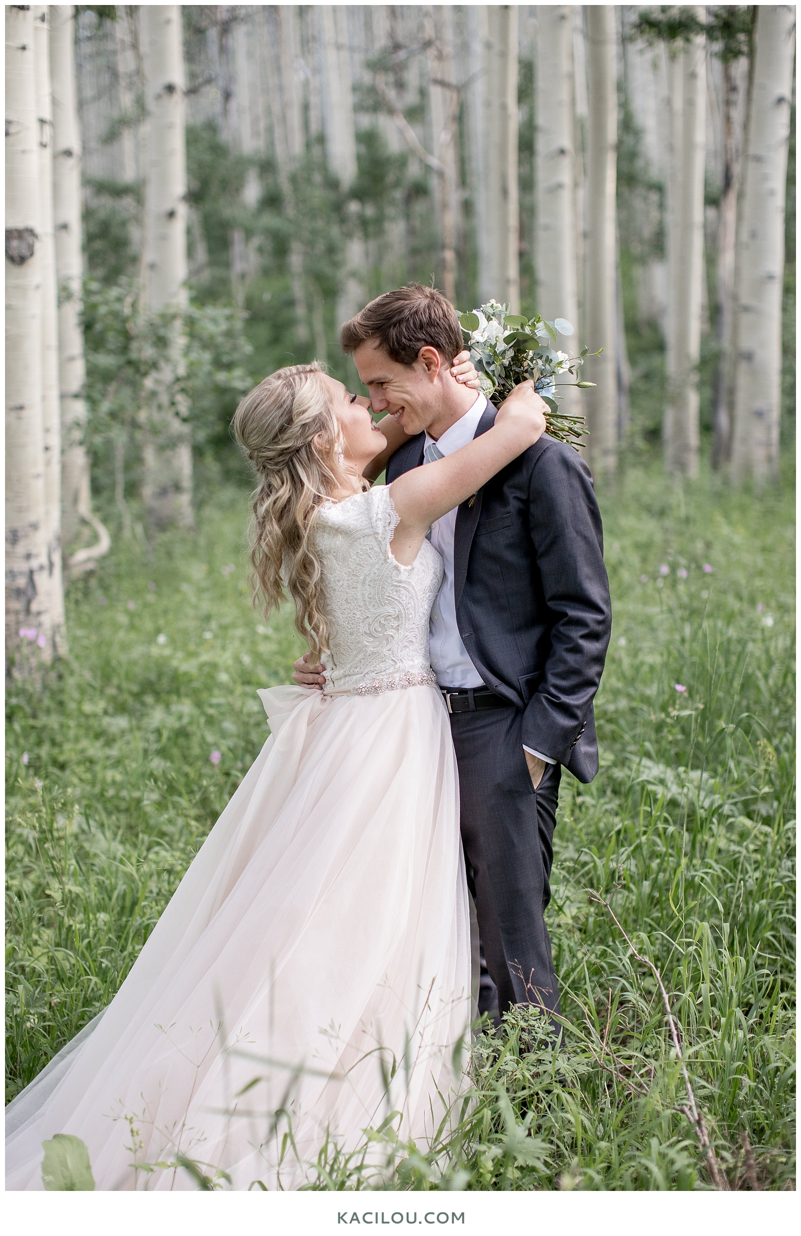 Park City Aspens with wedding couple holding each other in the center